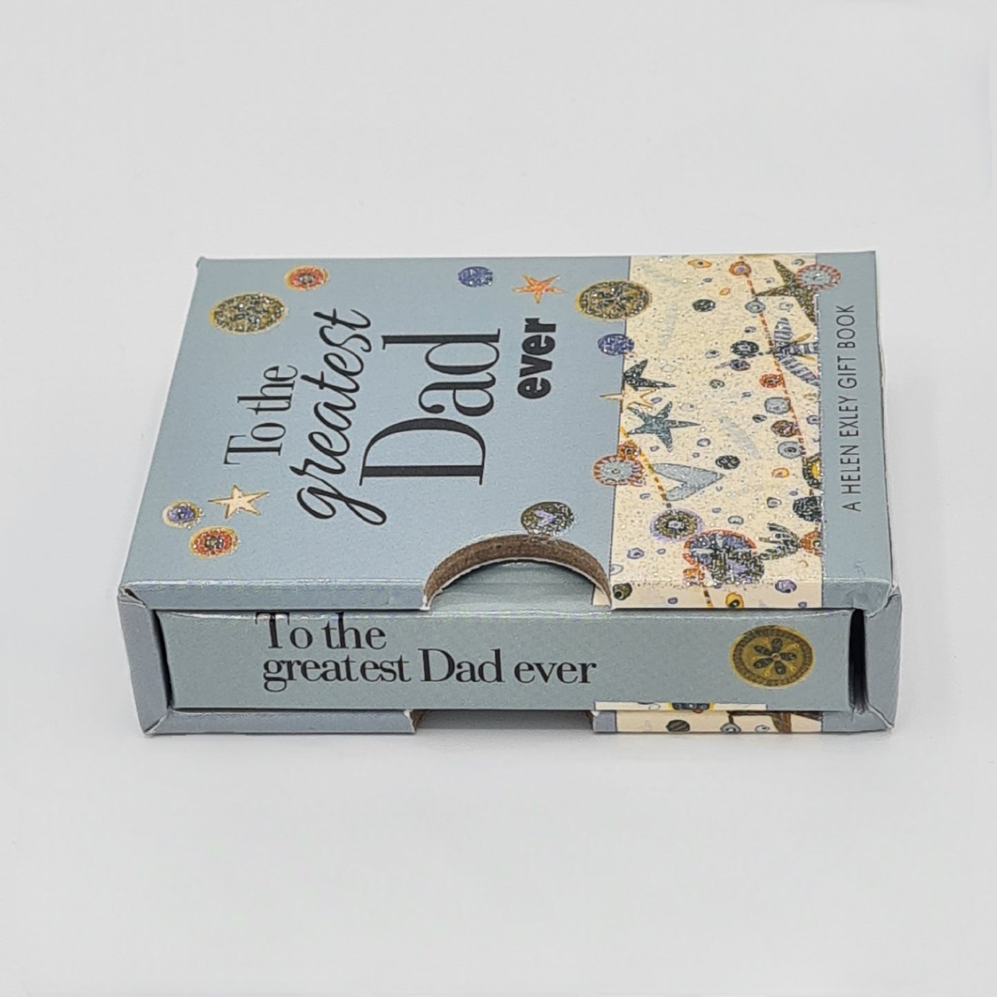 Light blue coloured small book inside a sleeve. The title of the book, "To the greatest dad ever" is visible on the top of the sleeve and also on the spine of the book.