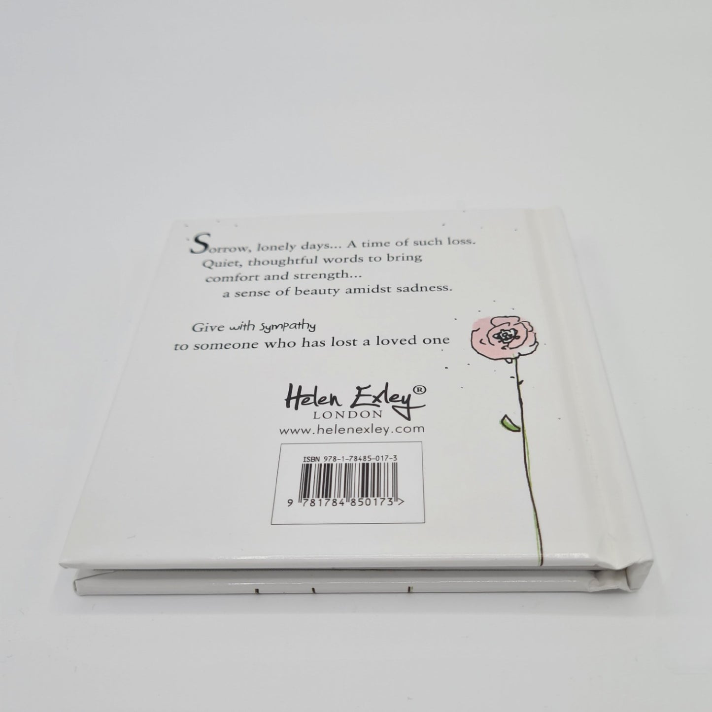 Back cover of little square book entitled "With Sympathy". The book is white and the cover includes the text "Sorrow, lonely days...A time of such loss. Quiet, thoughtful words to bring comfort and strength...a sense of beauty amidst sadness. Give "With Sympathy" to someone who has lost a loved one".