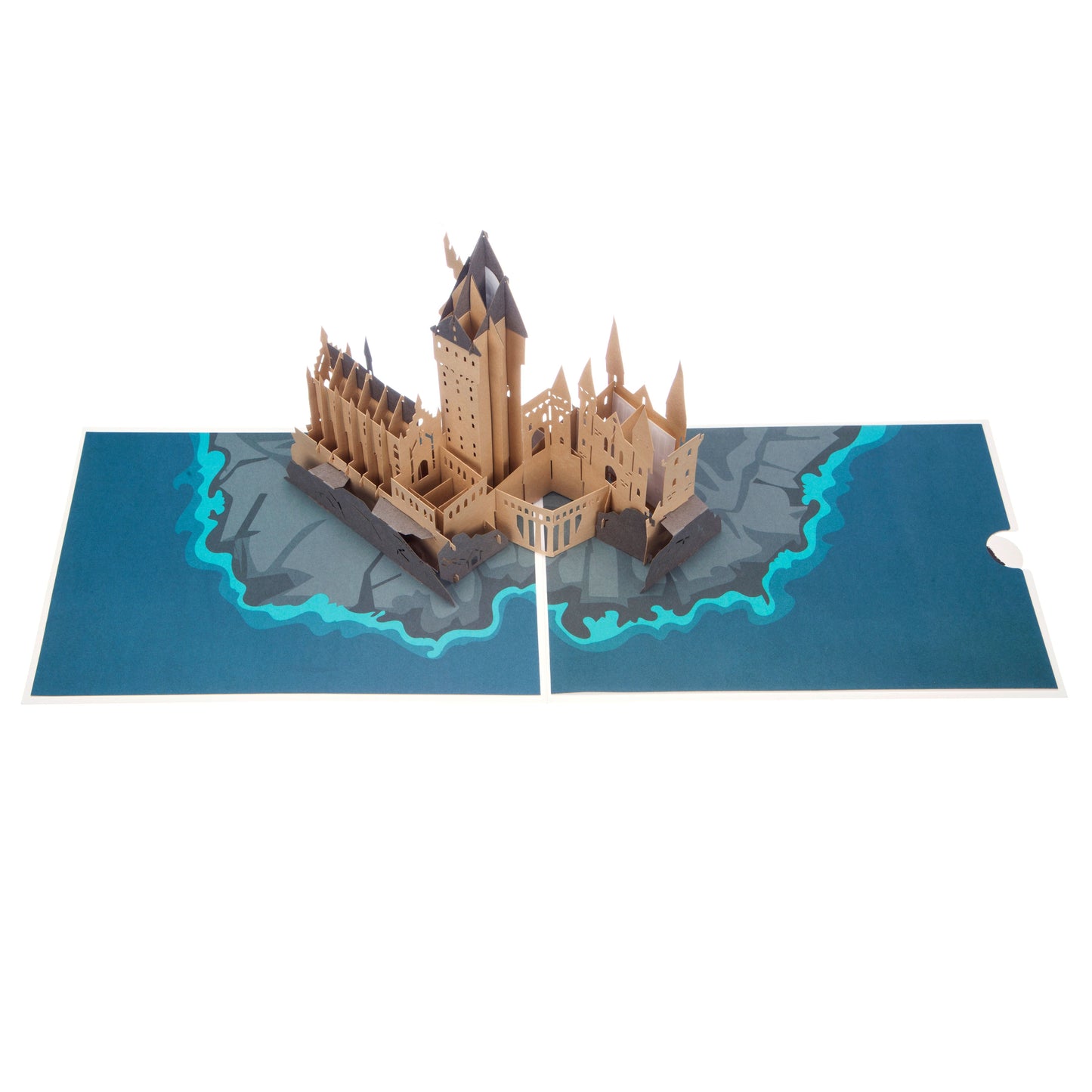 Aerial view of Hogwarts Castle card showing a "popped up" brown Hogwarts Castle on an illustration of rocks and water.