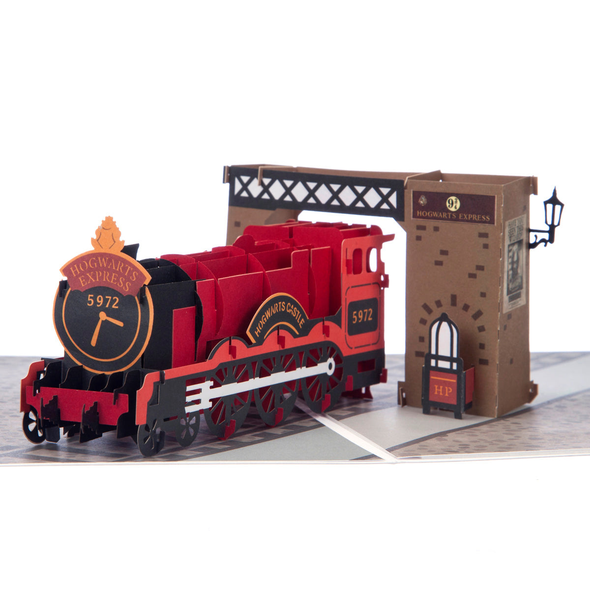 Close up of Hogwarts Express card showing pop up red Hogwarts Express train sitting on platform nine and three quarters.