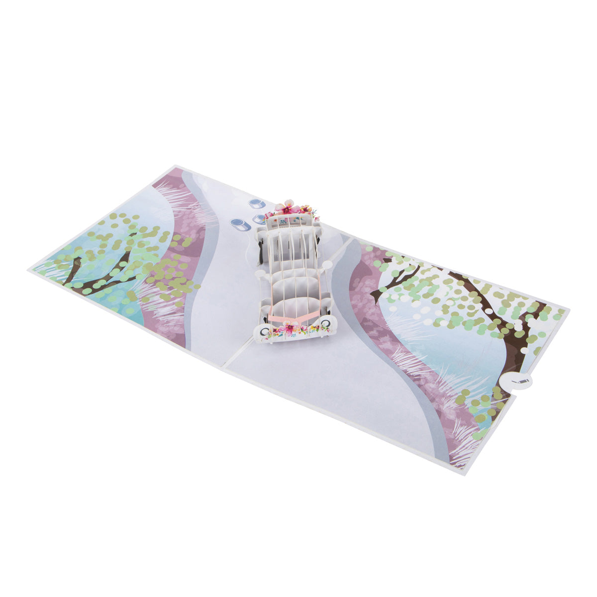 Aerial view of Wedding Car card showing a "popped up" white wedding car with pink ribbon tied to the front. It is sitting on an illustration of a road with flowers and trees to the side of the road.