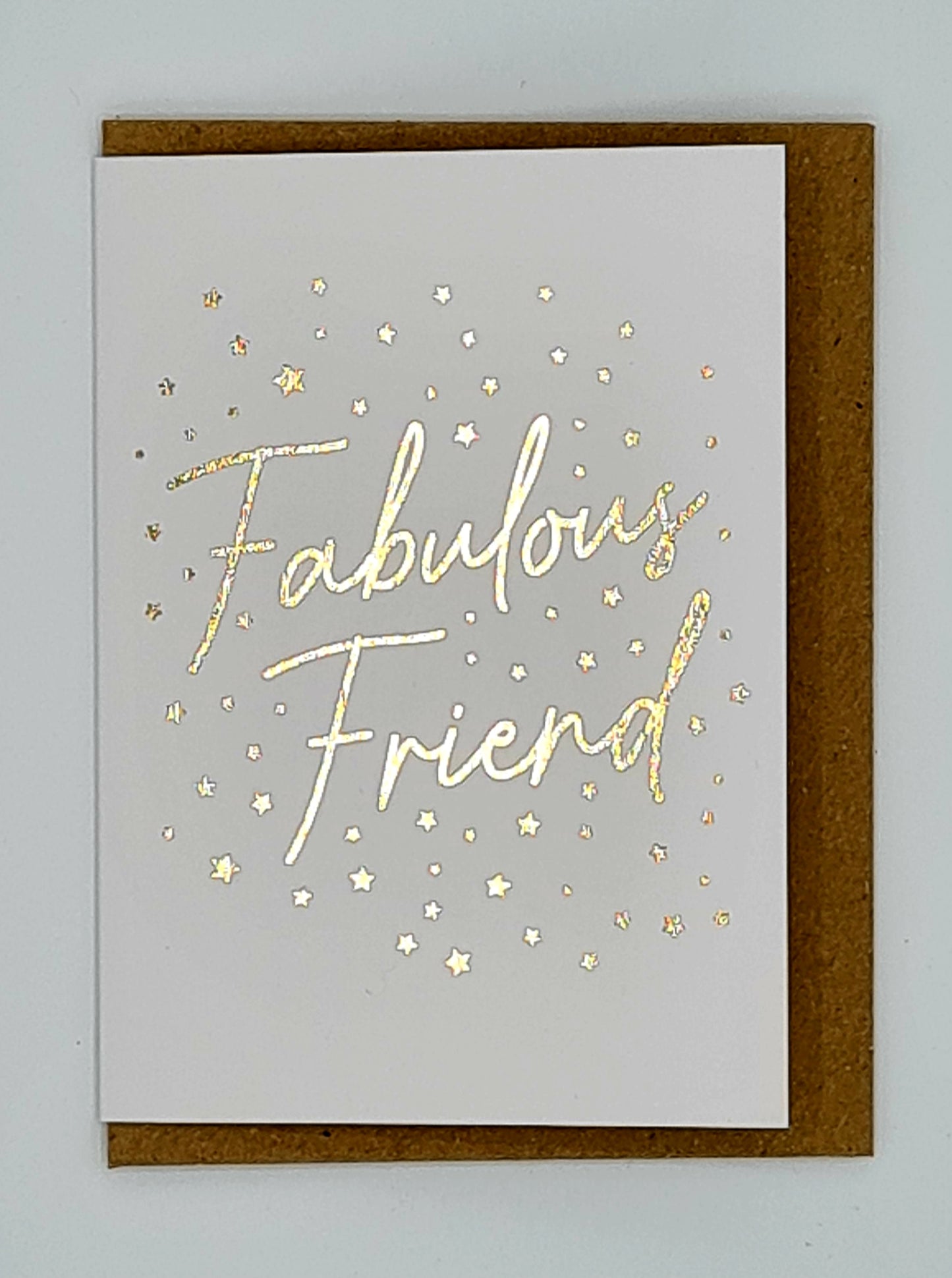 A7 minicard with brown envelope. The card is white with the words "Fabulous Friend" written in gold and surrounded by lots of little gold stars.