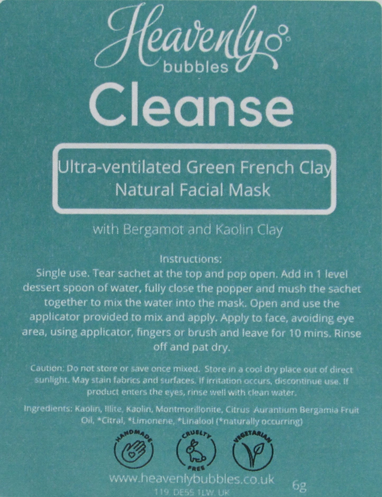 Close up of green label from Heavenly Bubbles Cleanse Ultra-ventilated Green French Clay Natural Facial Mask with Bergamot and Kaolin Clay. It shows the instructions for use and list of ingredients.