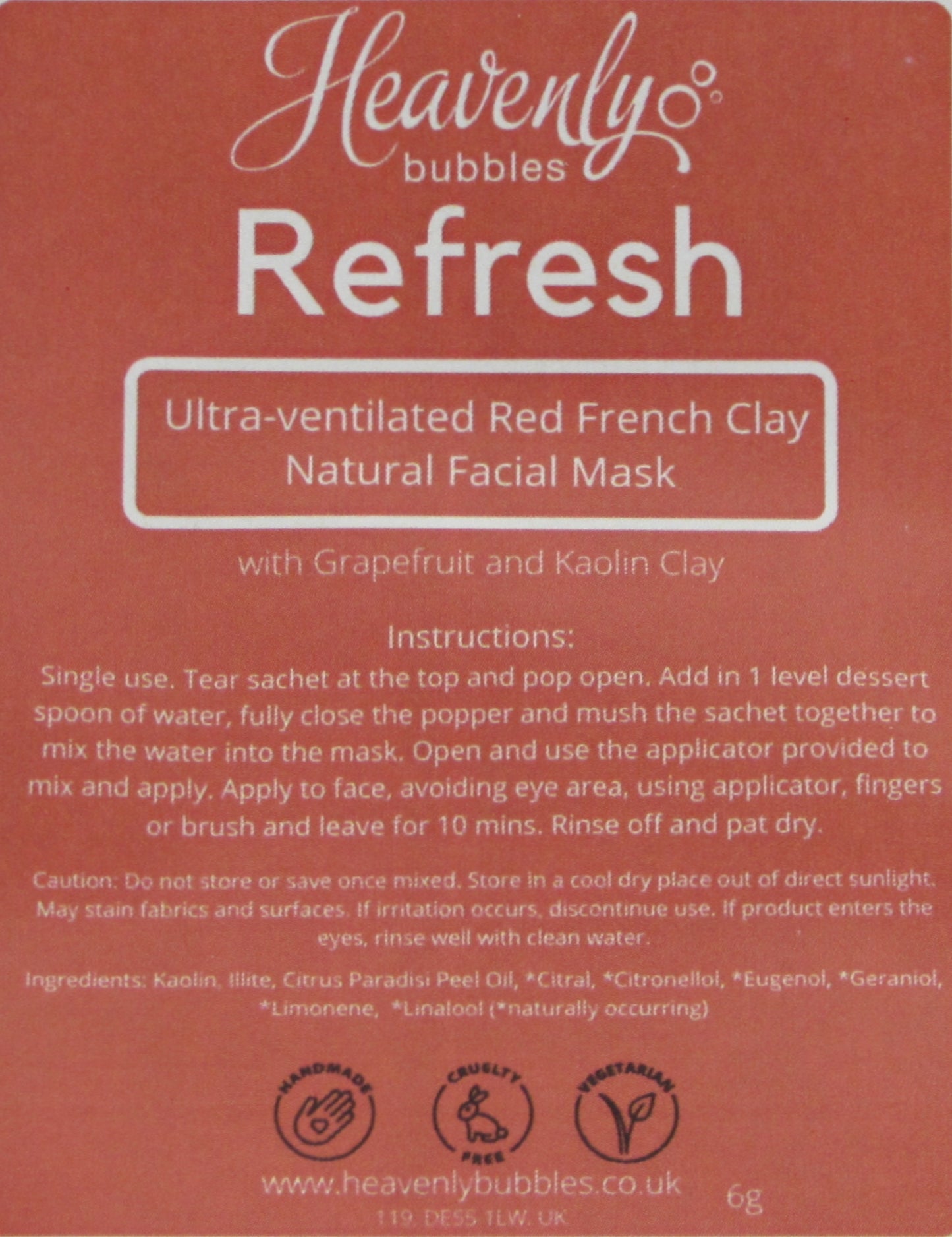 Close up of red label from Heavenly Bubbles Refresh Ultra-ventilated Red French Clay Natural Facial Mask with Grapefruit and Kaolin Clay. It shows the instructions for use and list of ingredients.