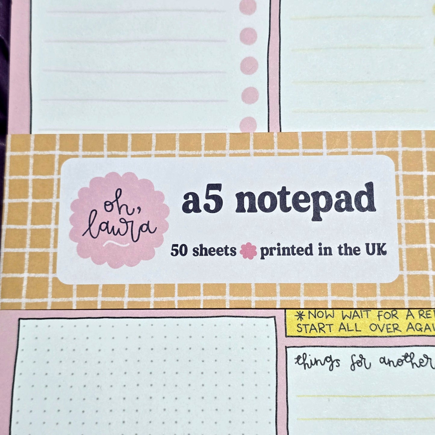 A5 notepad with grid and lined pages, featuring a label on top.