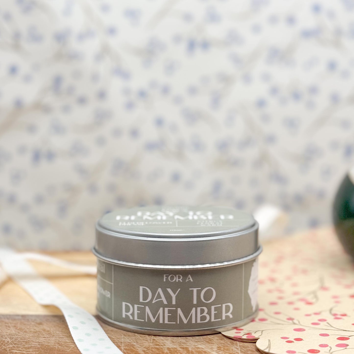 Side view of candle tin from Pintail Candles. The label is light green in colour and contains the wording "For a Day to Remember".