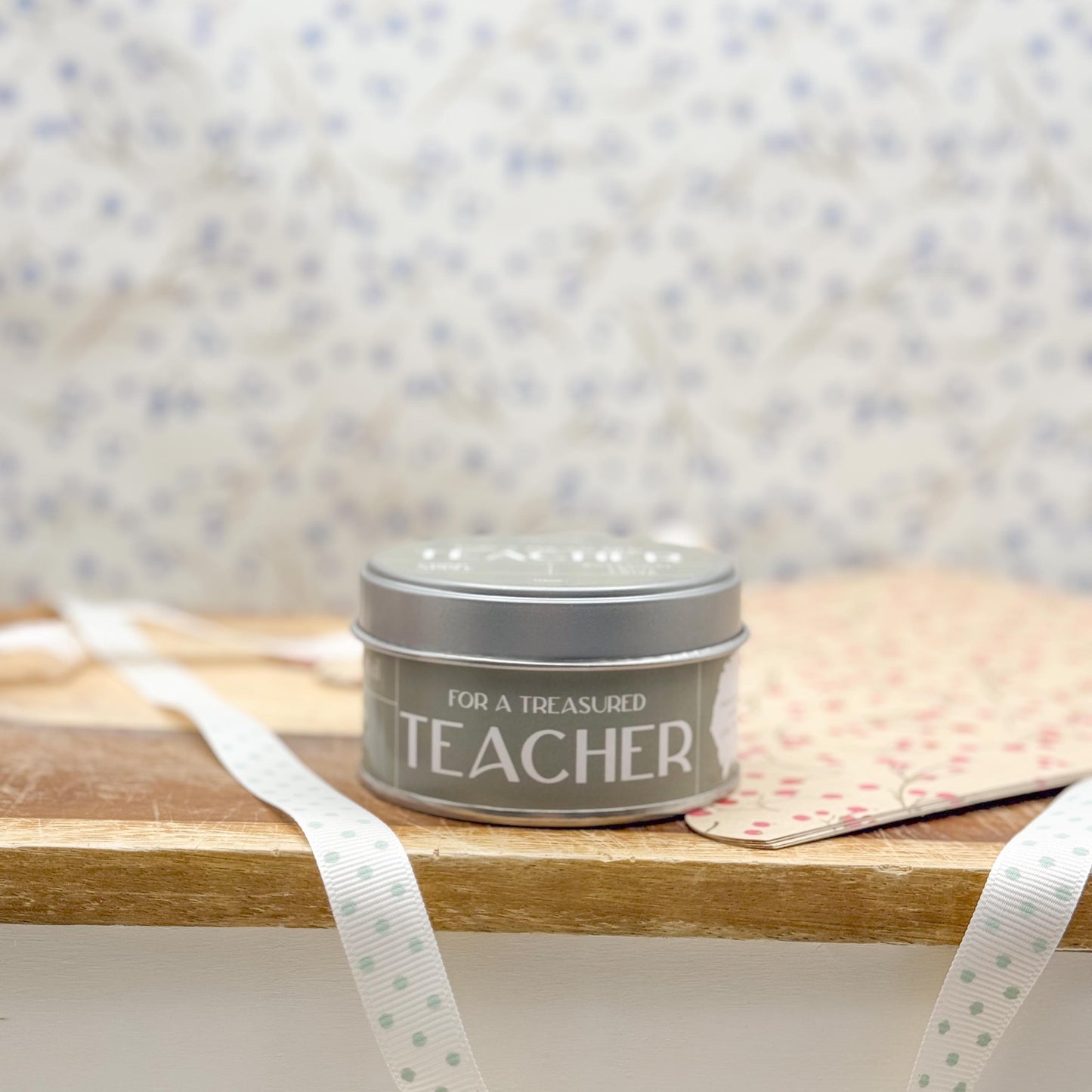 Side view of candle tin with the wording "For a Treasured Teacher".