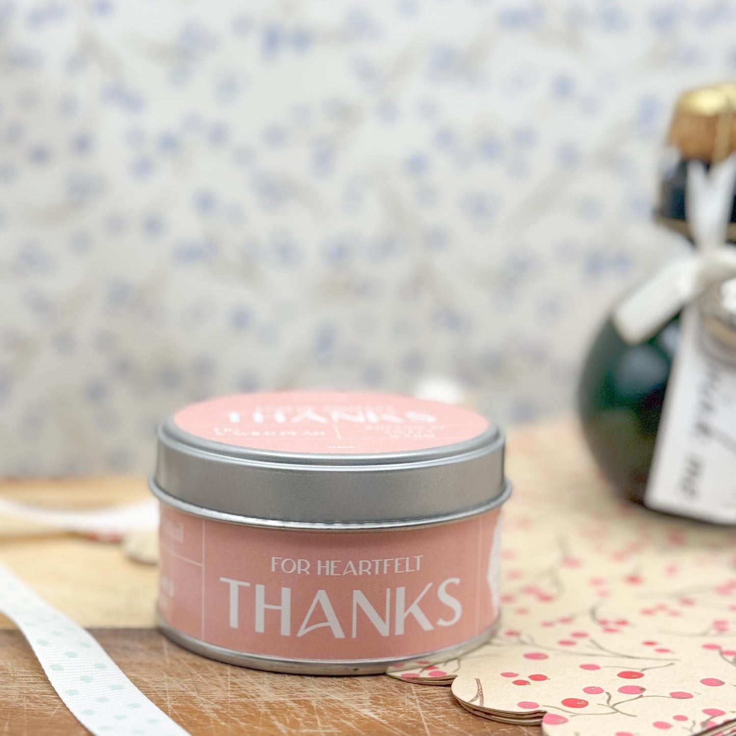 Side view of candle tin with pink label containing the wording "For Heartfelt Thanks".