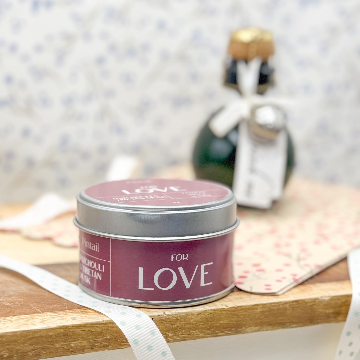 Side view of candle tin with the wording "For Love"