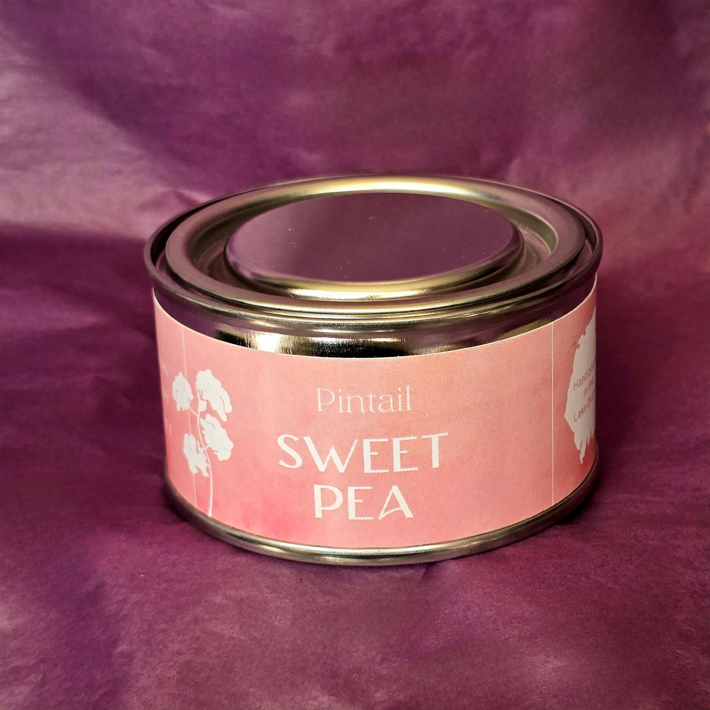 Petite paint pot candle tin from Pintail Candles. The pink coloured label on the tin says "Sweet Pea" and features an illustration of white sweet pea flowers.