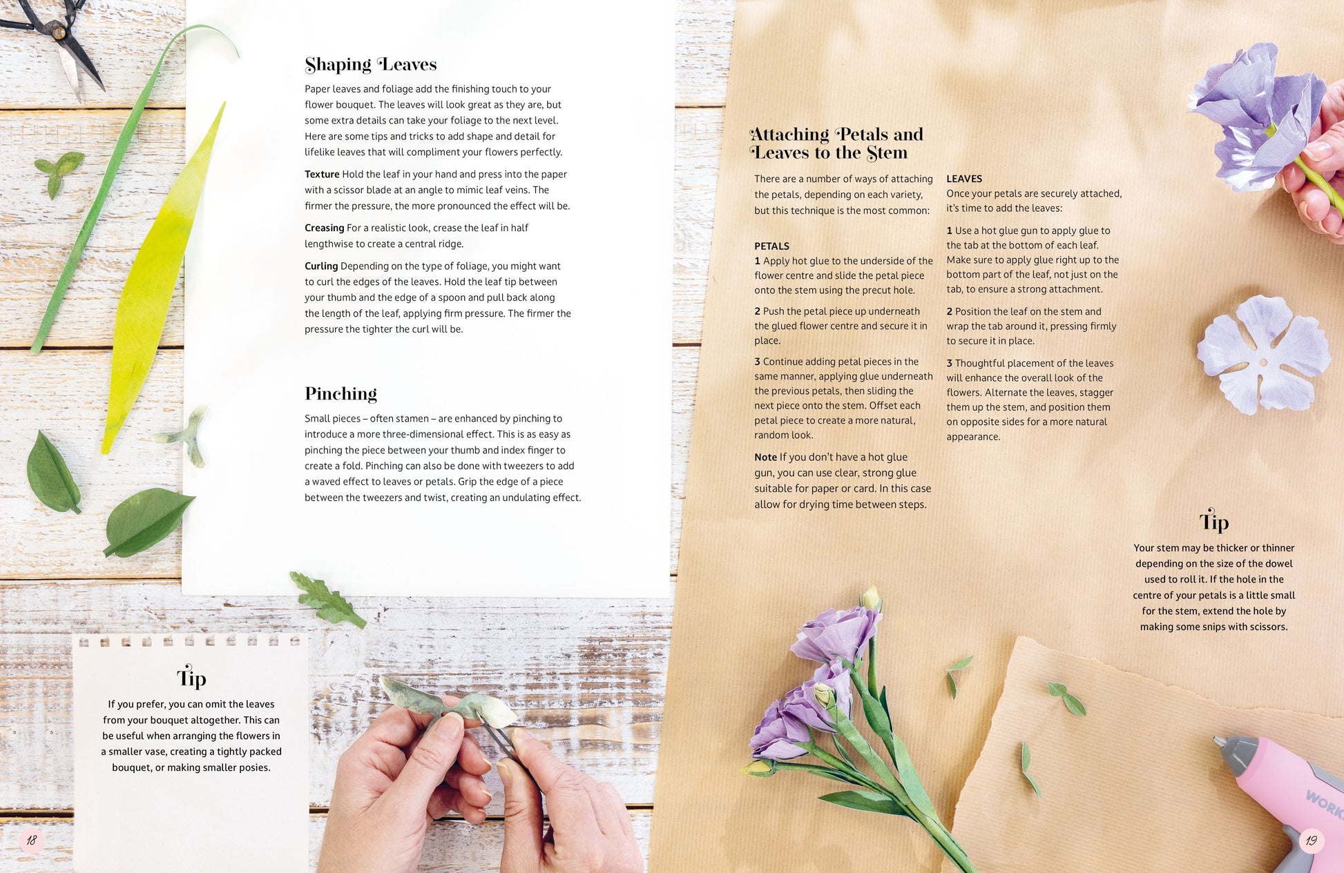 An open booklet or craft guide spread laid flat on a light wood surface, showing printed instructions titled 'Shaping Leaves' and 'Attaching Petals and Leaves to the Stem' with small photos of hands and floral elements around the pages.
