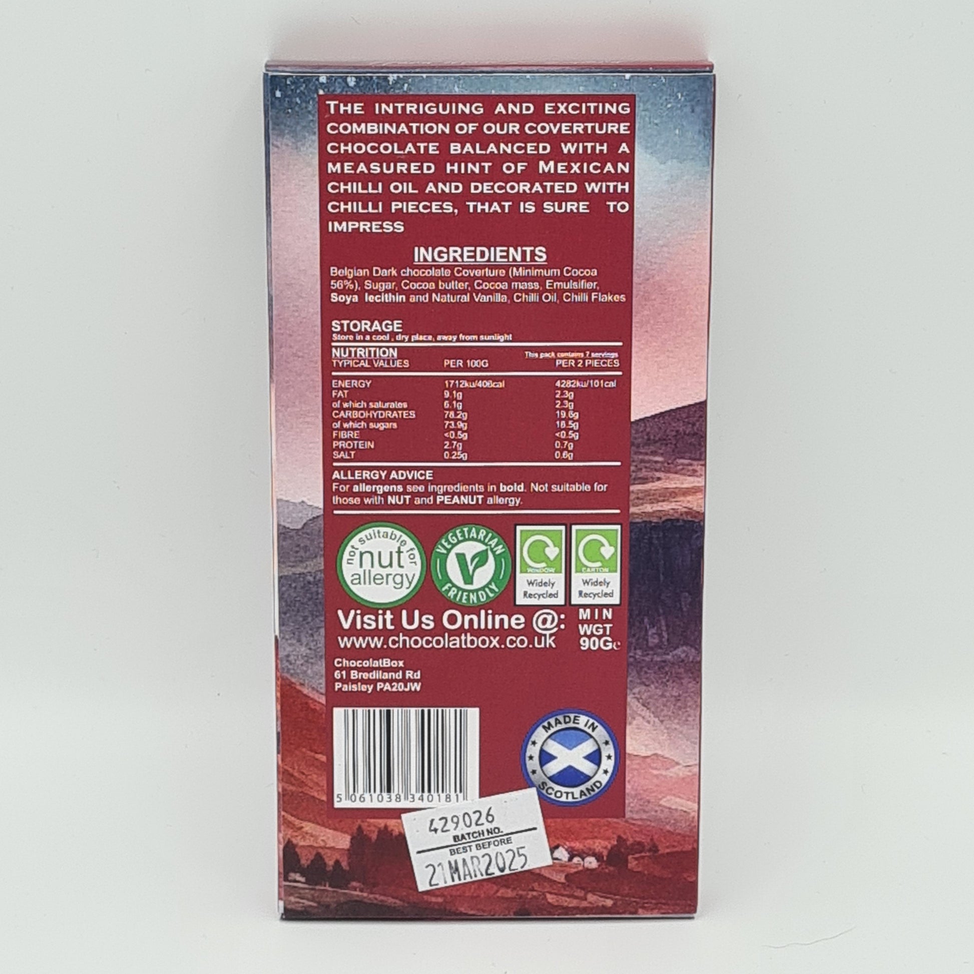 Back view of packaging for Mexican Chilli Chocolate Bar. Description at the top says "The intriguing and exciting combination of our coverture chocolate balanced with a measured hint of Mexican Chilli Oil and decorated with Chilli pieces, that is sure to impress".
It then lists the ingredients and nutritional information.
Allergy advice - For allergens see ingredients in bold. Not suitable for those with NUT and PEANUT allergy. 
Vegetarian Friendly.