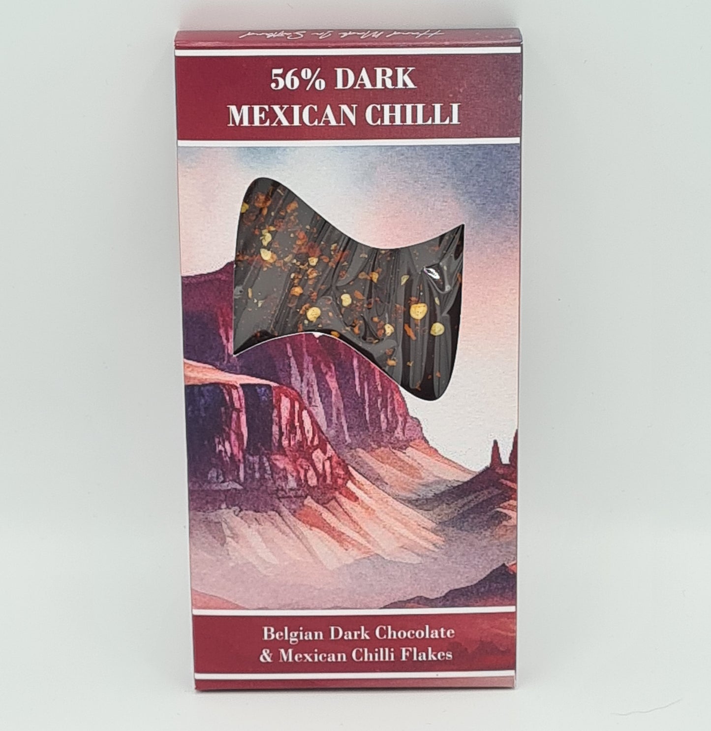 Front view of box packaging for 56% Dark Mexican Chilli Chocolate Bar. Text at the bottom of the box says "Belgian Dark Chocolate & Mexican Chilli Flakes".