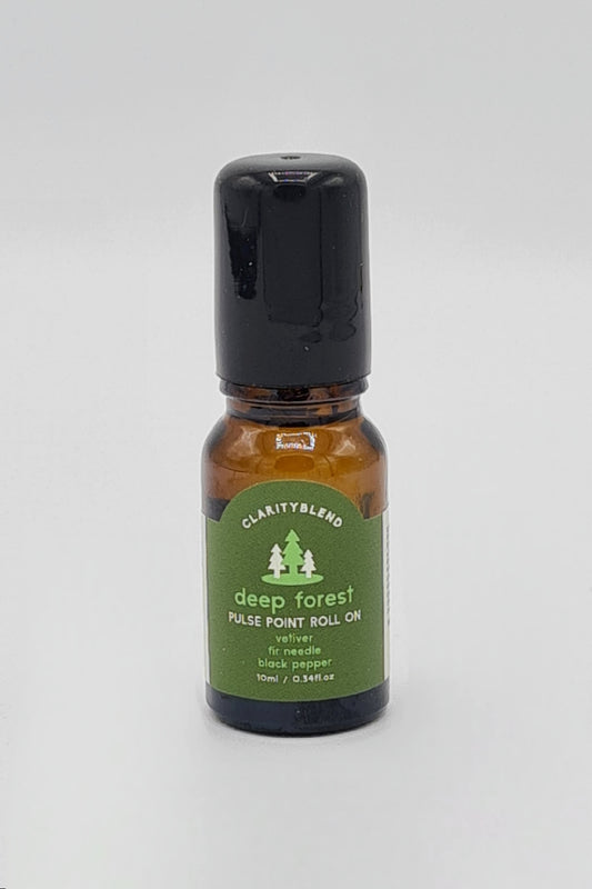 Small brown glass bottle with dark green label saying Clarity Blend Deep Forest Pulse Point Roll On