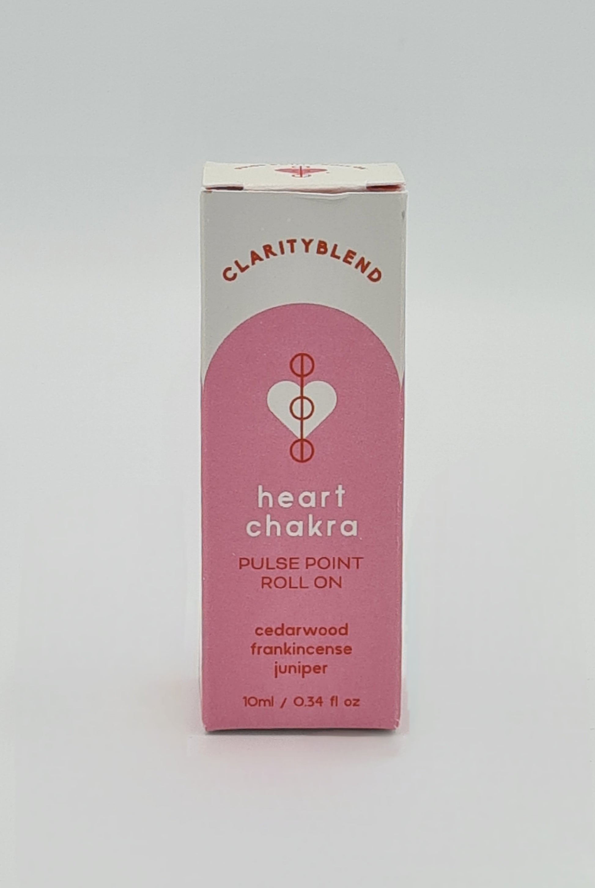 Front of box with pink label containing Clarity Blend Heart Chakra Pulse Point Roll On