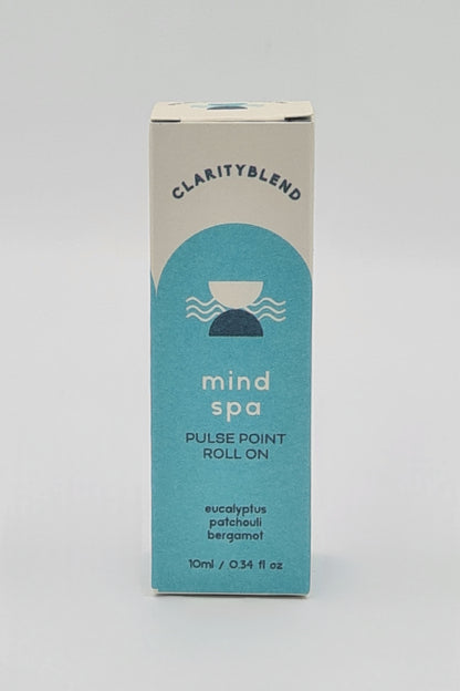 Front of box with light blue label containing Clarity Blend Mind Spa Pulse Point Roll On