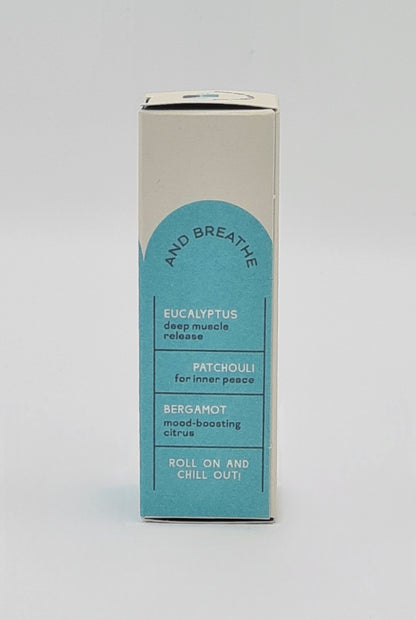 Side view of box with light blue label for Clarity Blend Mind Spa Pulse Point Roll On detailing ingredients - Eucalyptus for deep muscle release; Patchouli for inner peace; Bergamot - mood-boosting citrus. Tagline reads "Roll on and Chill Out".