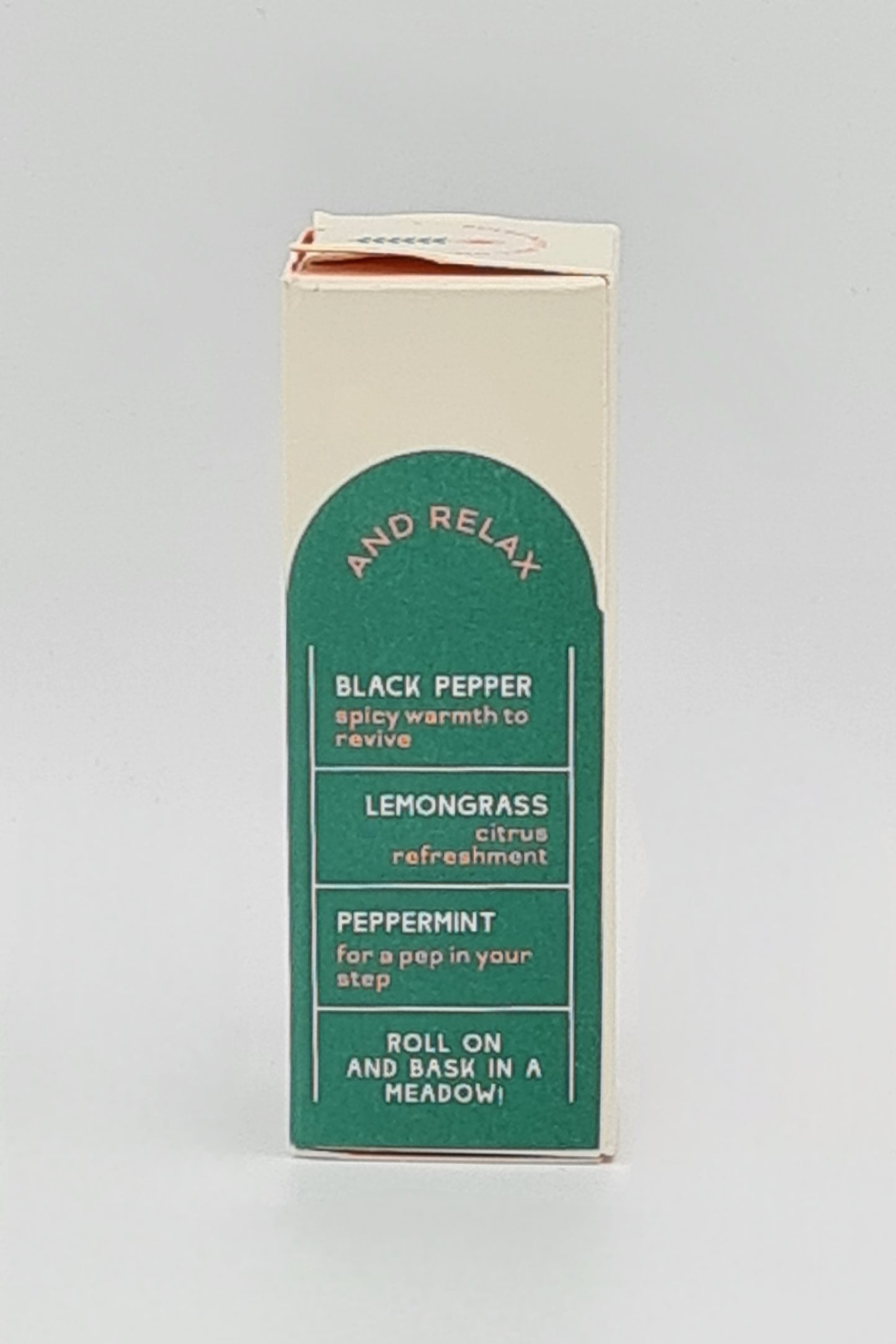 Side view of box with green label for Clarity Blend aromatherapy Summer Meadow Pulse Point Roll On detailing ingredients - Black Pepper with spicy warmth to revive; Lemongrass for citrus refreshment; Peppermint for a pep in your step.