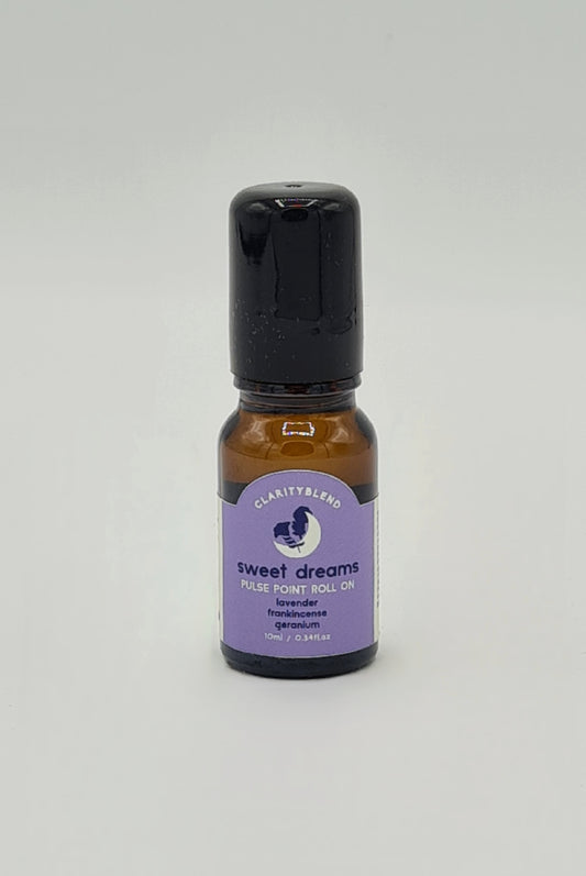 Small brown glass bottle with lilac label saying Clarity Blend Sweet Dreams Pulse Point Roll On