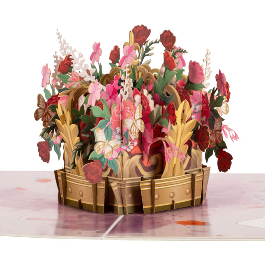 Close up of Floral Crown pop up card. There is a gold coloured crown filled with lots of flowers and foliage. The flowers are mainly pink and red.