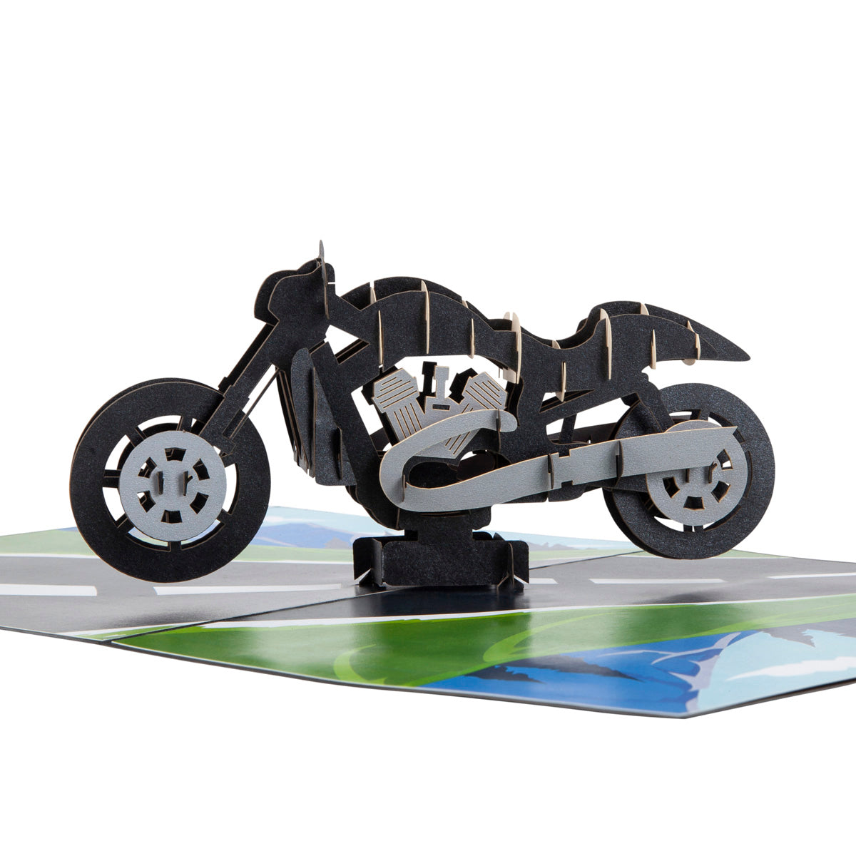 Close up of Motorbike pop up card showing a pop up black motorbike sitting on a road.