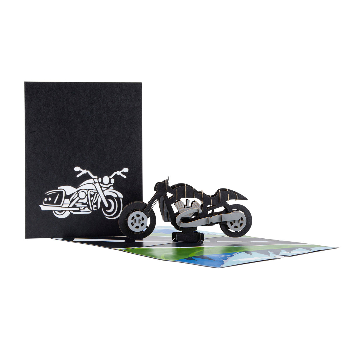 Two images together - the first one shows the front of the motorbike card, it is black card with a white cut out motorbike shape. The second image is of the open card with a "popped up" black motorbike inside 