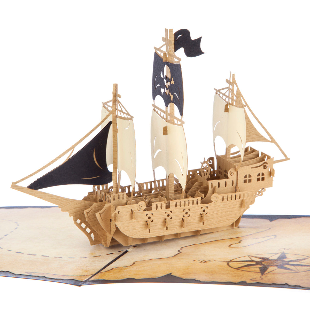 Close up of Pirate Ship pop up card showing a brown pirate ship with black and white sails sitting on top of a treasure map.