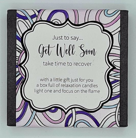 Small square black box with a coloured swirly label and a text box saying "Just to say...Get Well Soon, take time to recover...with a little gift just for you, a box full of relaxation candles, light one and focus on the flame". 