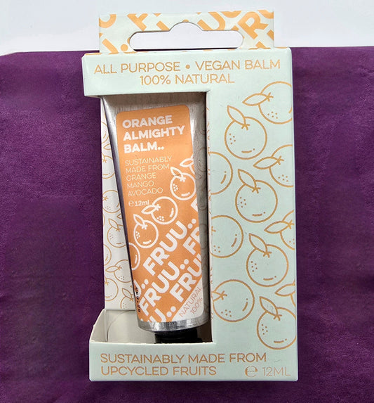 Orange balm in a branded packaging on a purple background