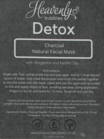 Close up of black label from Heavenly Bubbles Detox Charcoal Natural Facial Mask with Bergamot and Kaolin Clay. It shows the instructions for use and list of ingredients.