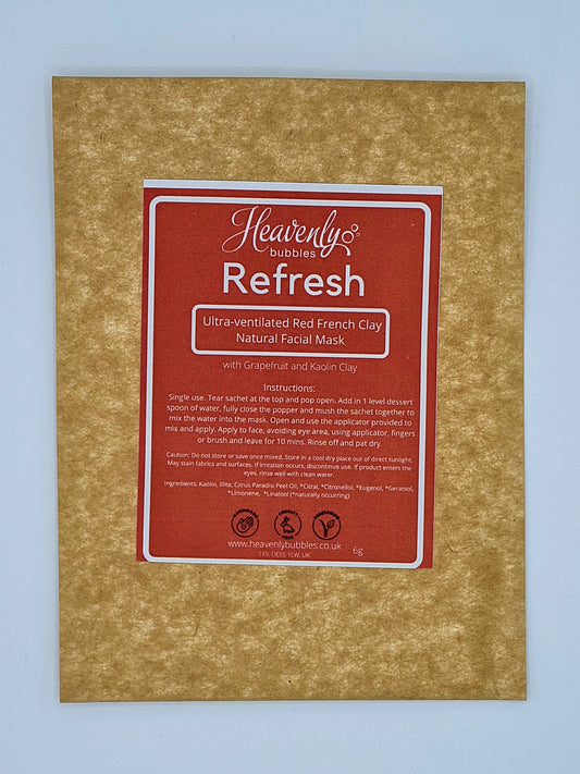 Brown kraft pouch with red label from Heavenly Bubbles, stating Refresh, Ultra-ventilated Red French Clay Natural Facial Mask with Grapefruit and Kaolin Clay.