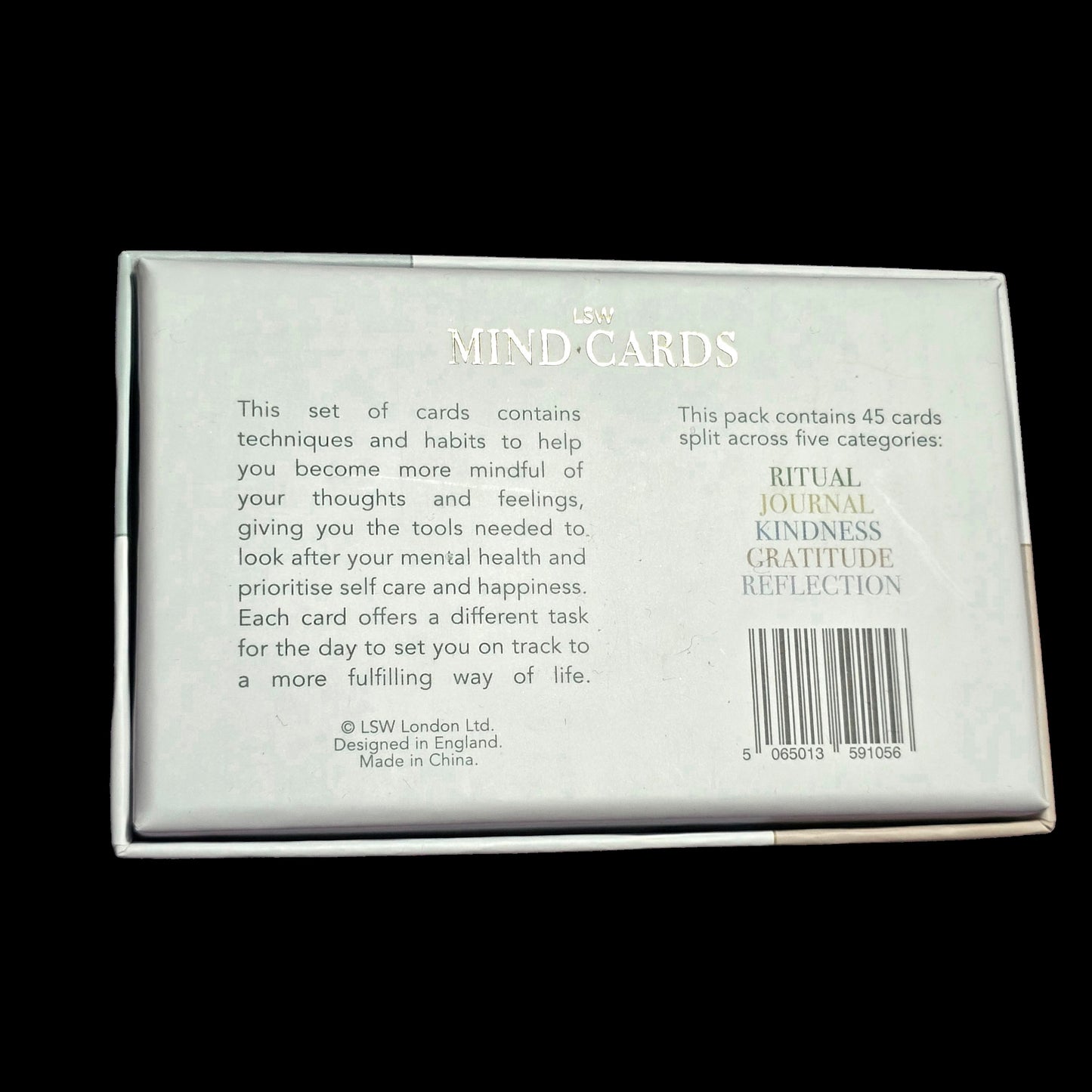 Packaging of 'MIND-CARDS' with text on a black background