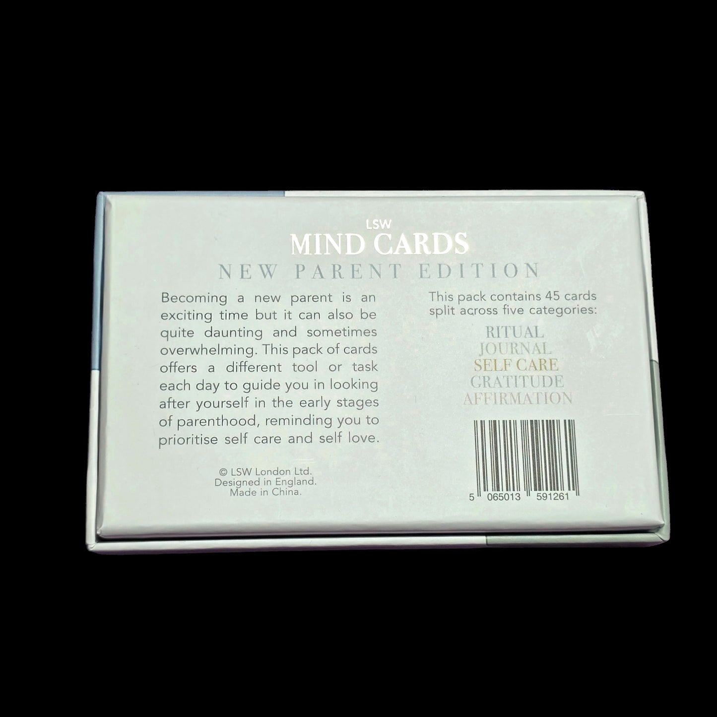Pack of 'MIND CARDS' for new parents on a black background