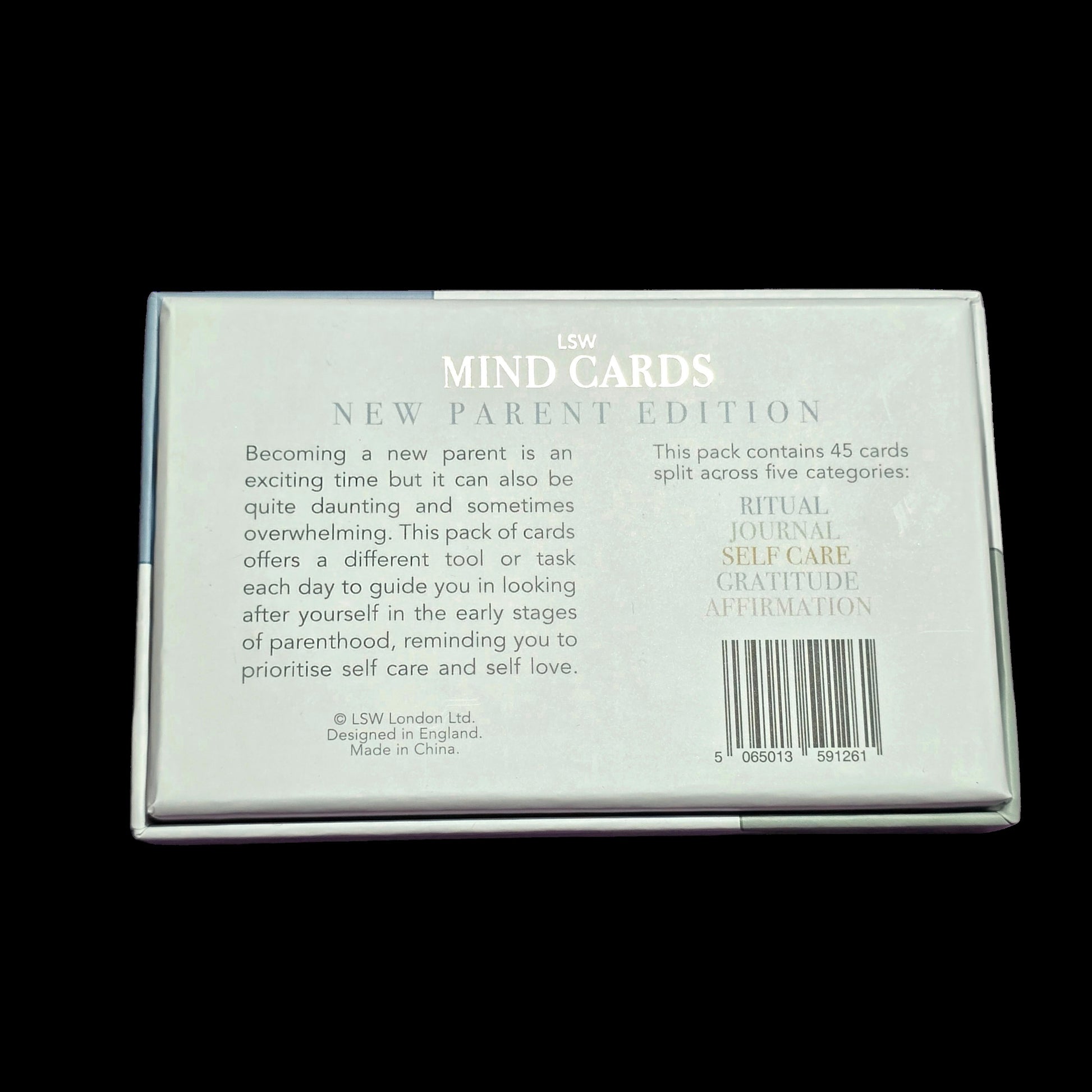Pack of 'MIND CARDS' for new parents on a black background