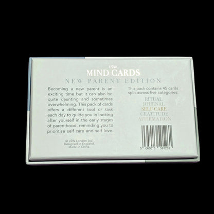 Pack of 'MIND CARDS' for new parents on a black background