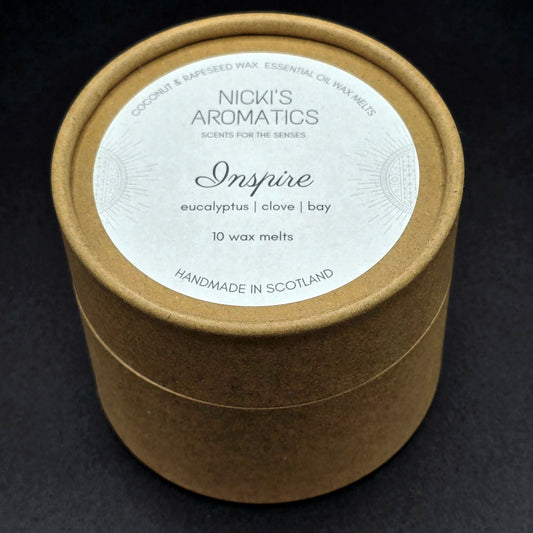 Brown kraft round cardboard tube containing 10 wax melts from Nicki's Aromatics. The label says "Inspire - Eucalyptus, Clove, Bay".