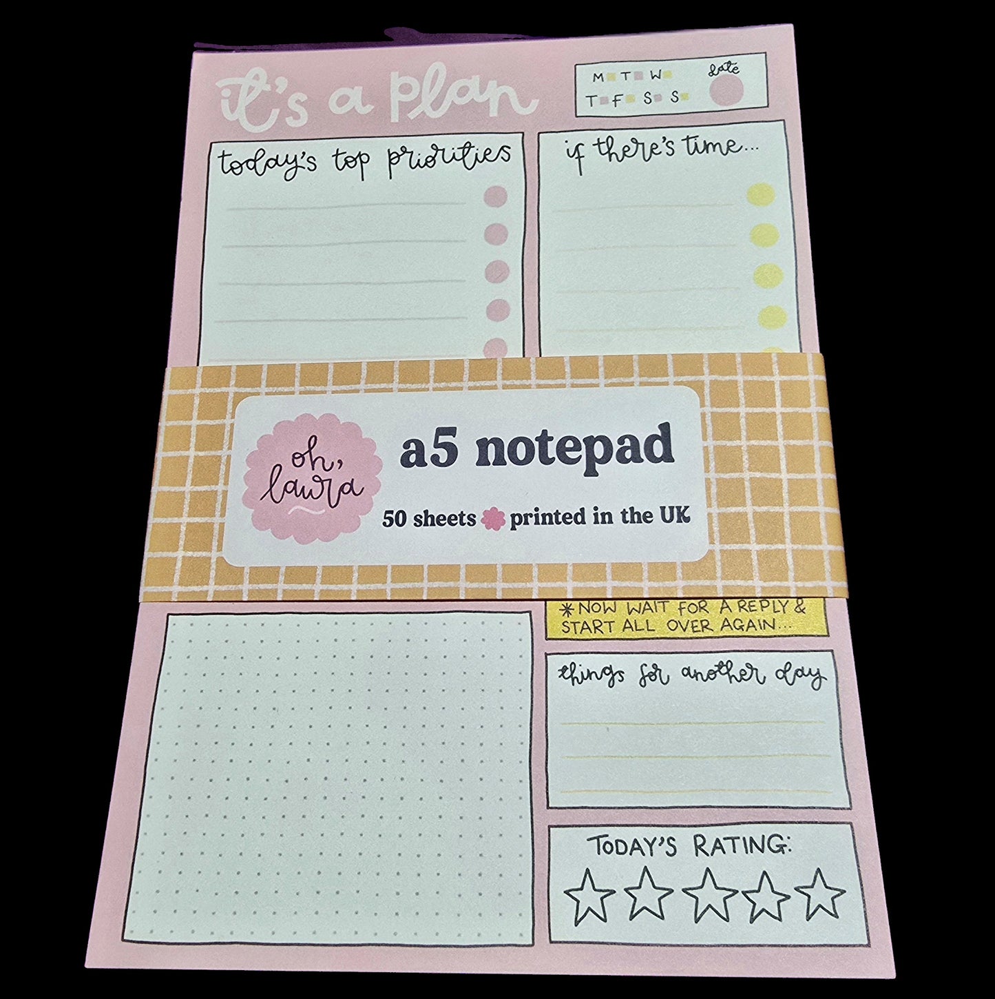 Notepad with planner-style design on a black background