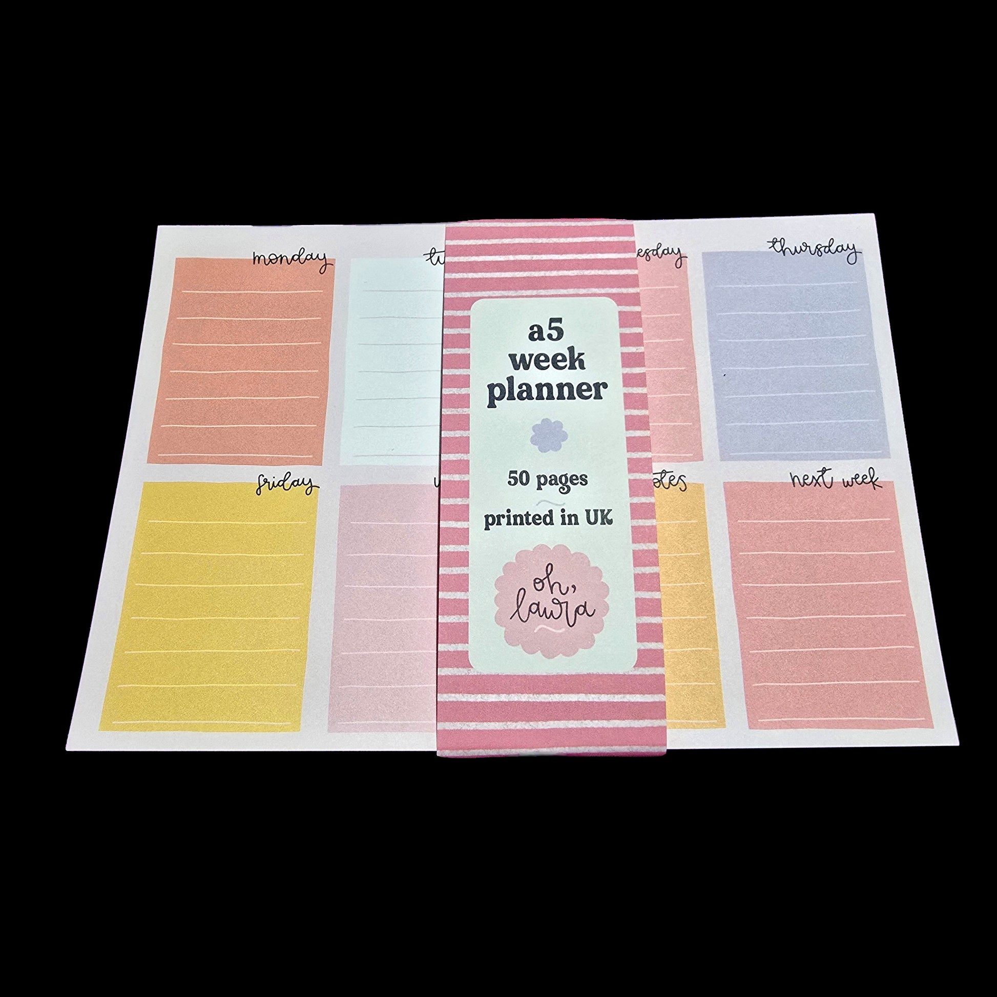 A5 week planner with colorful days of the week labels on a white background