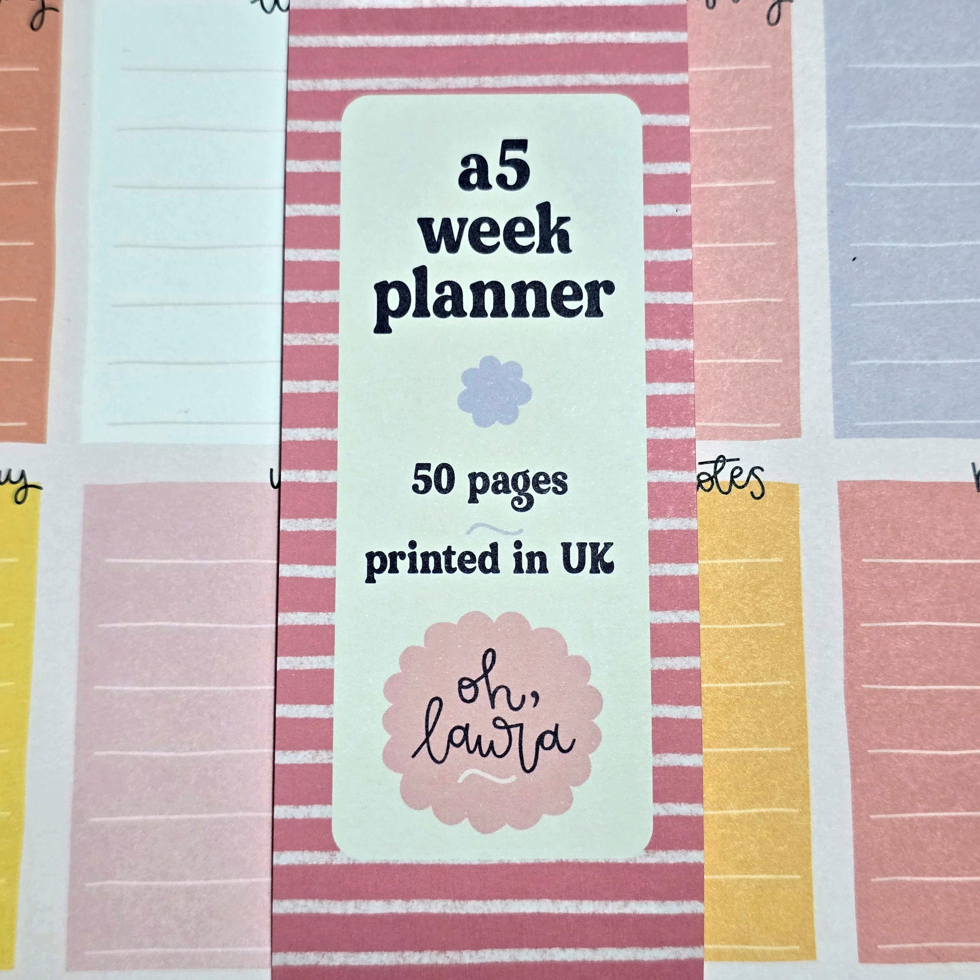 Sheet of planner stickers with text and a brand logo on a striped background