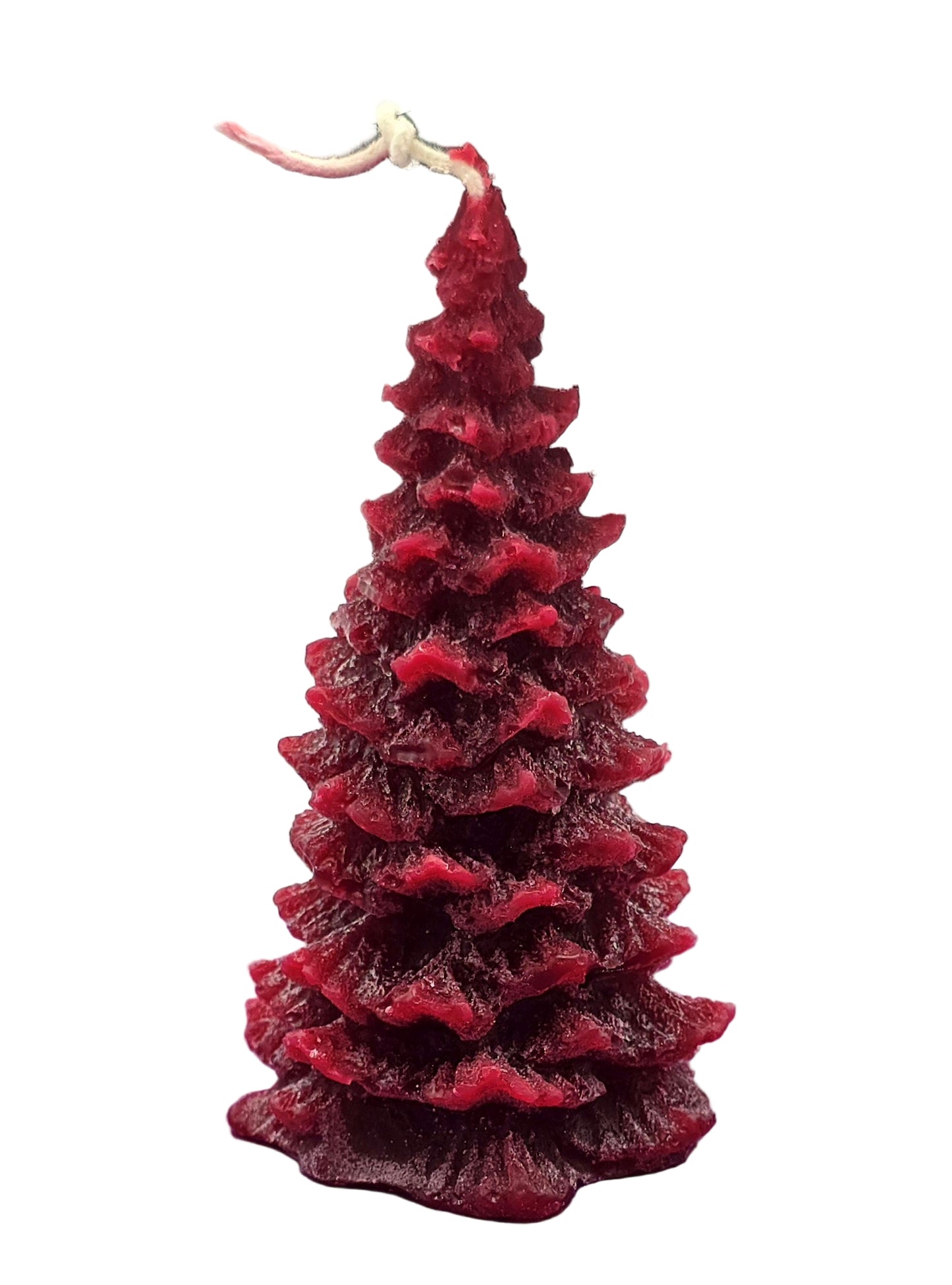 Red tree-shaped candle on a white background
