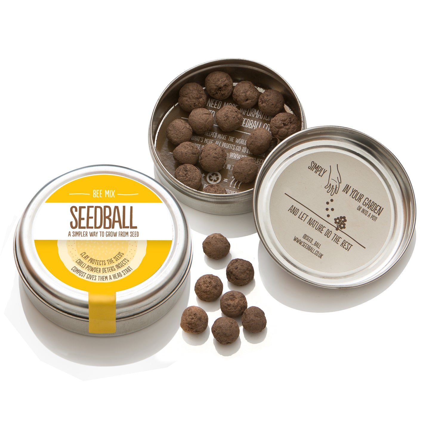 Two silver tins from Seedball. The first tin is closed and has a yellow label with "Bee Mix" while the other tin is open - in the bottom half of the tin there are 14 visible seedballs whilst the top half of the tin has an inner label stating "Simply scatter (illustrated by a picture of a hand scattering the seeds) in your garden or into a pot and let nature do the rest". There are 6 seedballs placed between the two tins. 