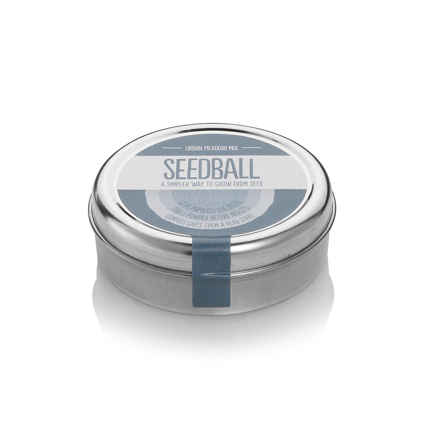 Round silver tin with grey label from Seedball, stating "Urban Meadow Mix". 