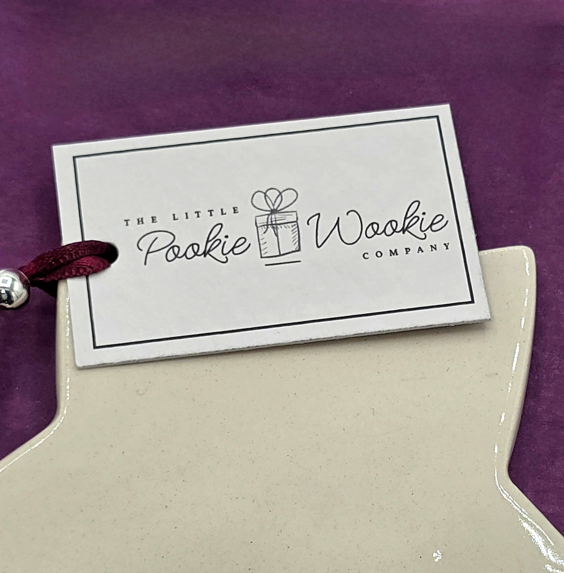 Product with a label from The Little Pookie Wookie Company on a purple background