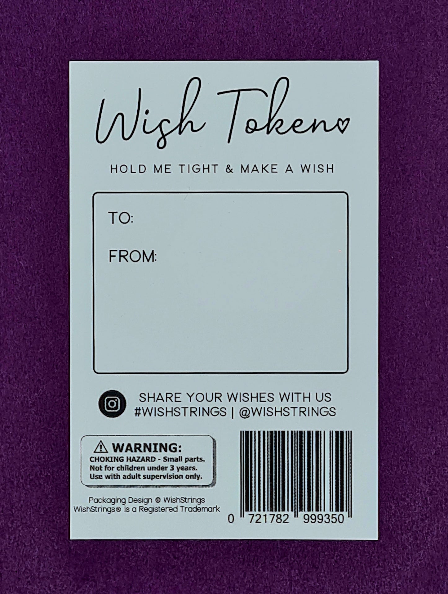 Back view of the card on which the Little Hug Tokens are mounted. It is white and says "Wish Token, Hold Me Tight & Make A Wish" at the top, below this there is a textbox with "To:" and "From:" for the sender to write their own message.