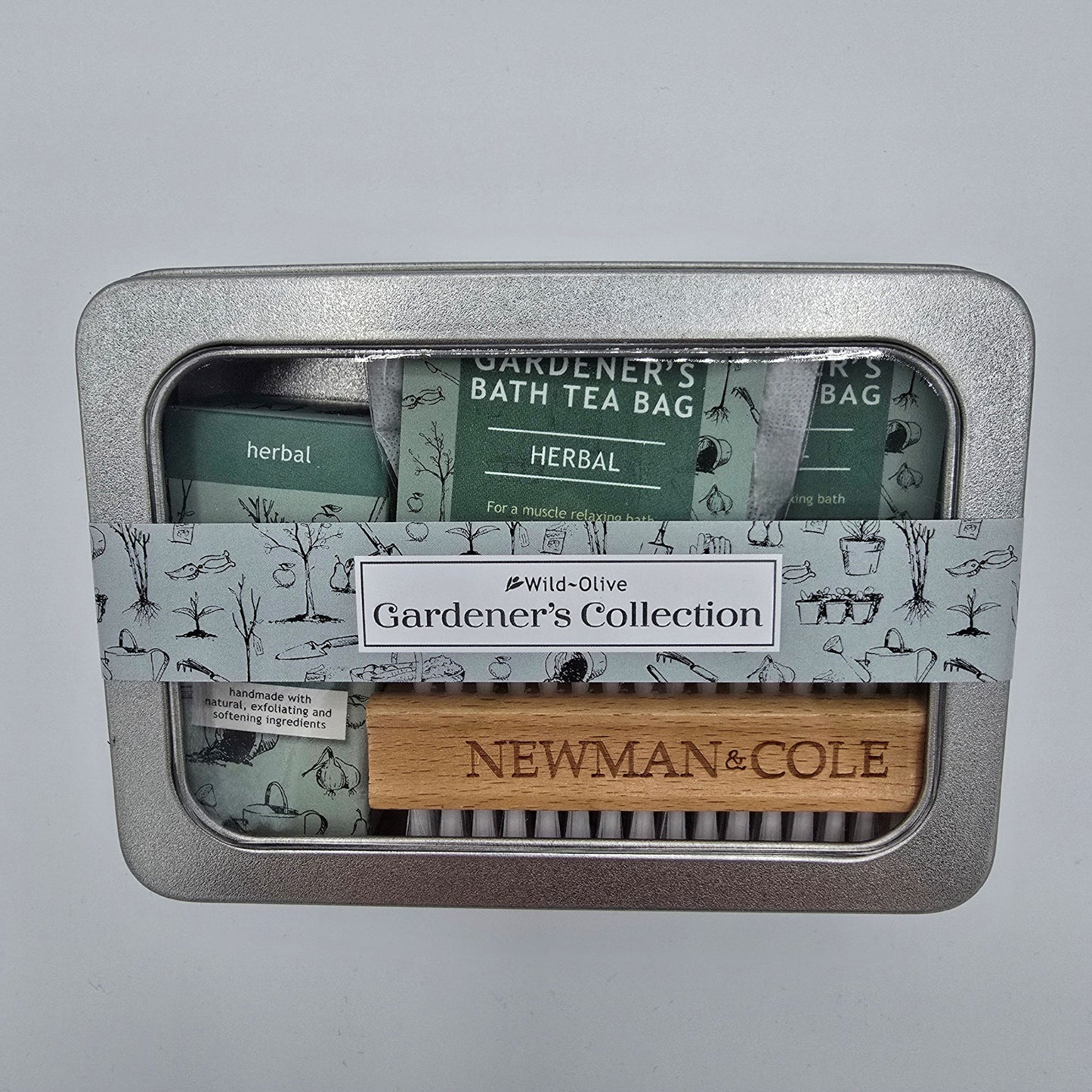 Silver tin containing Gardeners Collection gift set from Wild Olive