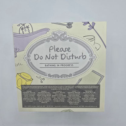 Product packaging with 'Please Do Not Disturb' text on a light background