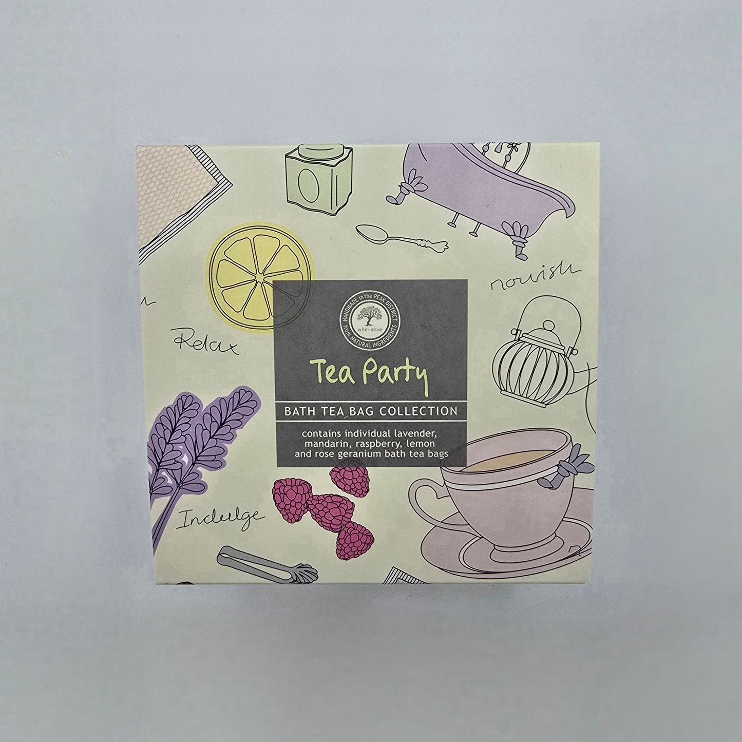 Box of 'Tea Party' bath tea bag collection with illustrations on a light gray background